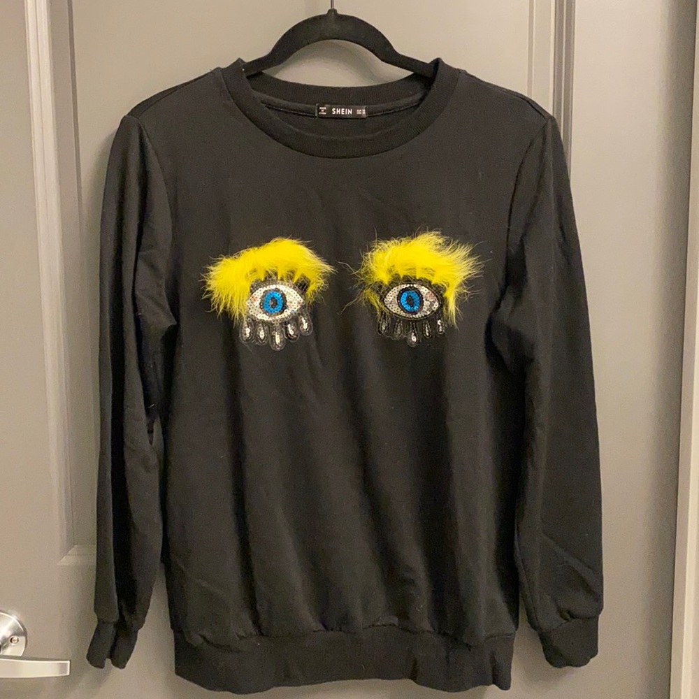 Cute black sweatshirt with sequin eye patches